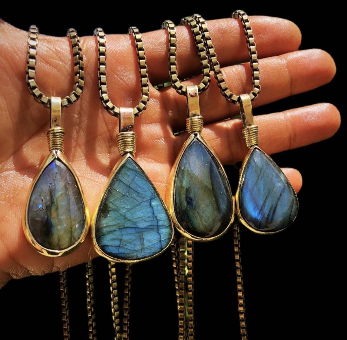 Four labradorite teardrop pendants