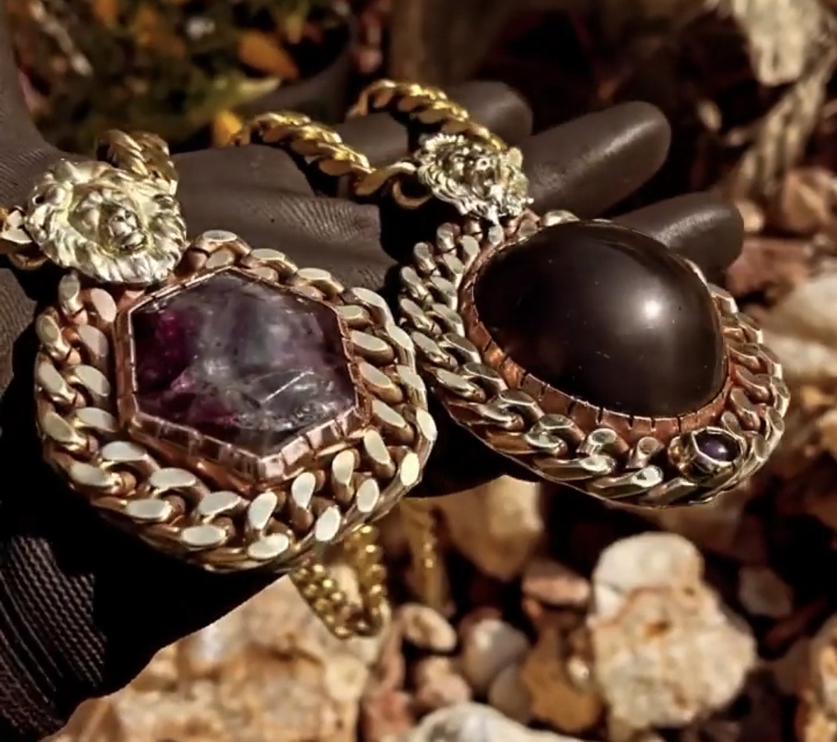 Amethyst and obsidian lion-head pendants