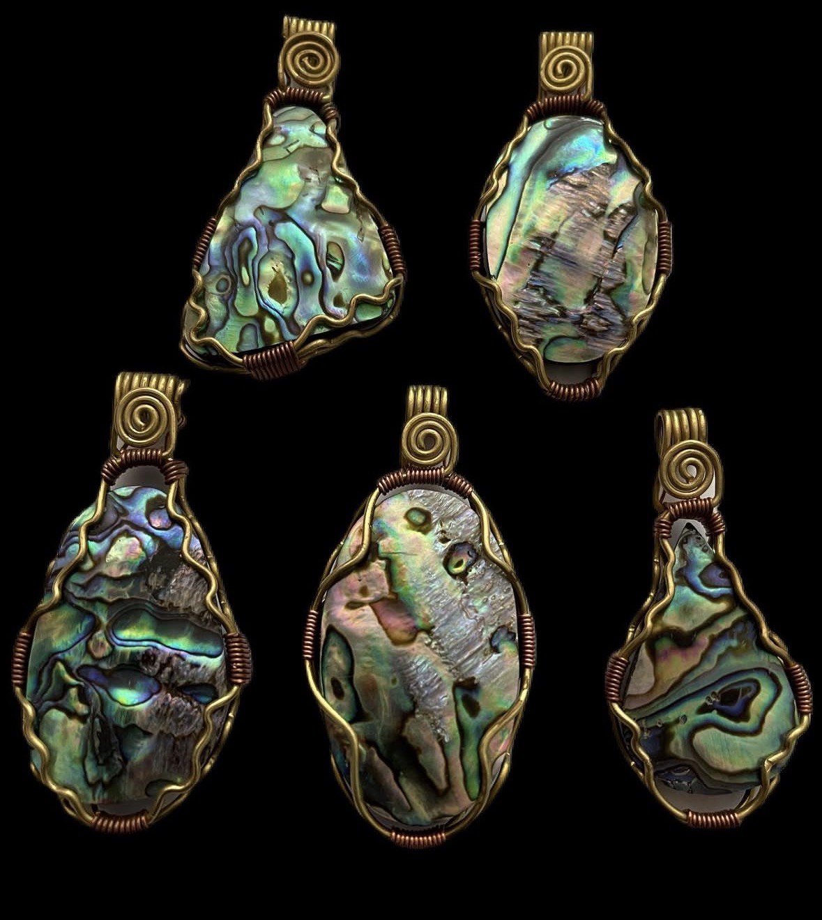 Iridescent abalone pendants on black